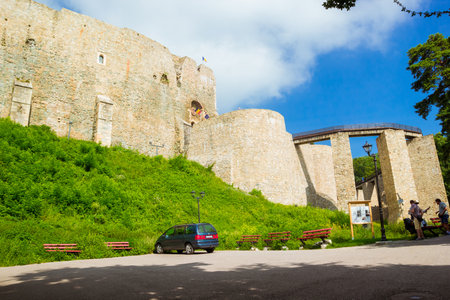 Targu Neamt, Romania - August, 2019: Cetatea Neamt, a place filled with history. the Neamt Citadel under the cloudy blue sky. It is a medieval fortress located in north-eastern part of Romania.のeditorial素材