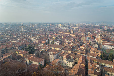 view point from the castle on the city of Brescia on a sunny clear day against a bright blue sky. Brescia castle. Brescia, Lombardy, Italy.の写真素材