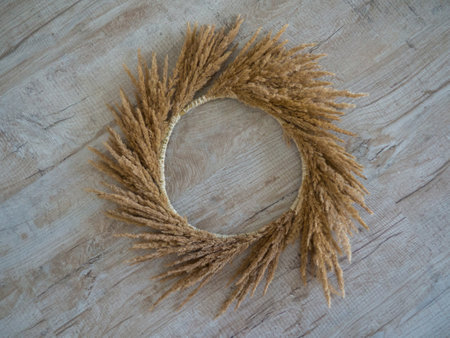 Step 5. Steps of making autumn door wreath from flowers and plants, step by step, tutorial. Florist at work. Creative crafts. Do it yourself. DIY with children home decor.の写真素材