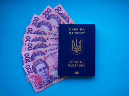 Close up of Ukrainian money with a face value of 200 hryvnia. Background of the two hundred hryvnia banknotes and passport. Enterprise capital investment, finance, corruption and travel concept.の写真素材