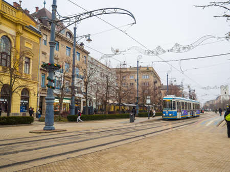 Debrecen, Hungary - December, 2021: Tram on the central street in Debrecen. Historical center of the Debrecen, the second largest city in Hungary after Budapest.のeditorial素材