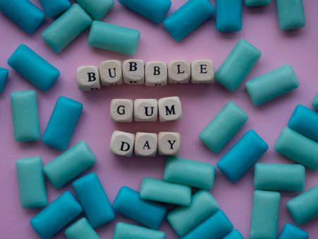 Bubble gum day. Colored bubble gum background with text Bubble Gum Day. Blue and green pads of...