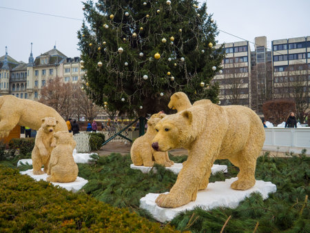 Debrecen, Hungary - December, 2021:The Kossuth square at Christmas time. Installation with bears in front of fir tree on daytime at Christmas market.のeditorial素材