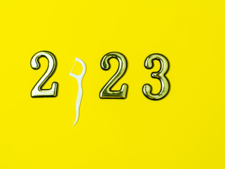 2023 and dental concept. Close up view photo with 2023 and white dental floss stick instead zero on...