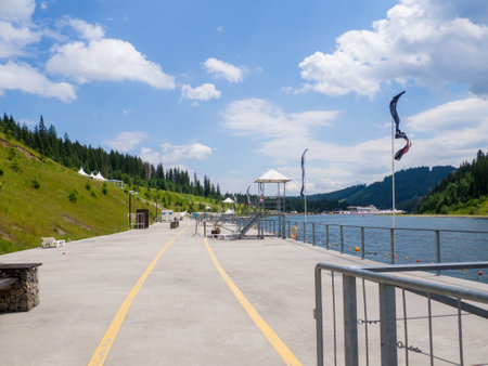 Sights of the modern popular ski resort of Bukovel. Empty Lake of Youth beach in Bukovel in summer. It is the largest ski resort in Eastern Europe located in West of Ukraine.の写真素材