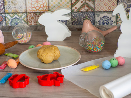 Close-up kneaded ginger dough for carving figurines from it. The shapes of rabbit. Cutting sugar...