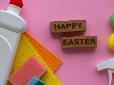 Happy Easter and cleaning concept. Detergent with Easter decoration on pink background with copy space. Easter great card. flat lay. Cleaning stuff and colorful eggs. housekeepingの写真素材