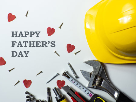 Construction tools, hard hat on white background with copy space. Construction greeting card for Dad on Fathers day. For advertising or web design. repair home. flat layの写真素材