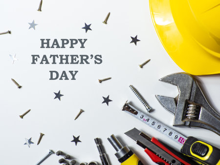 Construction tools, hard hat on white background with copy space. Construction greeting card for Dad on Fathers day. For advertising or web design. Repair home. Flat layの写真素材