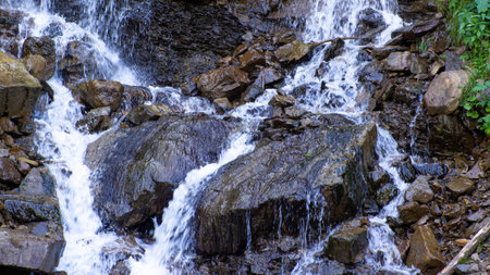 Cascade Trufanets Falls. Landscape of waterfall in the Ukrainian Carpathian Mountains. The water flows beautifully over the rocks. Mountain river. Beautiful big waterfall in the mountains.の写真素材