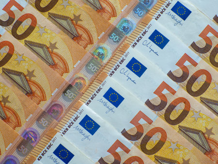 A set of European Union money with a face value of 50 euros. Background of the fifty euros banknotes with copy space. Enterprise capital investment, finance, savings, corruption and bank concept.の写真素材