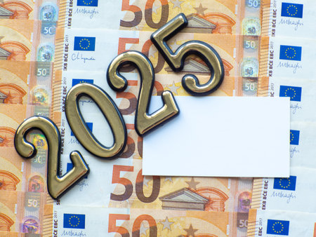 Set of European Union money with a face value of 50 euros. Background of the fifty euros banknotes and 2025 with copy space. Enterprise capital investment, finance, savings, bank and New Year conceptの写真素材