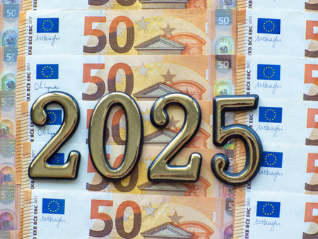 Set of European Union money with a face value of 50 euros. Background of the fifty euros banknotes and 2025 with copy space. Enterprise capital investment, finance, savings, bank and New Year conceptの写真素材
