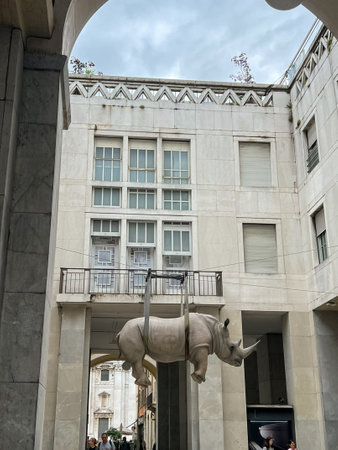 Brescia, Italy - June, 2024: Monumental version of Il Peso del Tempo Sospeso by Stefano Bombardieri placed in Piazza della Vittoria of Brescia. The rhino becomes the metaphor of the weight upon us.のeditorial素材