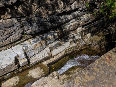 This image showcases the intricate textures, layers, and age-old cracks found in sedimentary rock. It illustrates geological processes that shaped the earth's surface over millennia.の写真素材