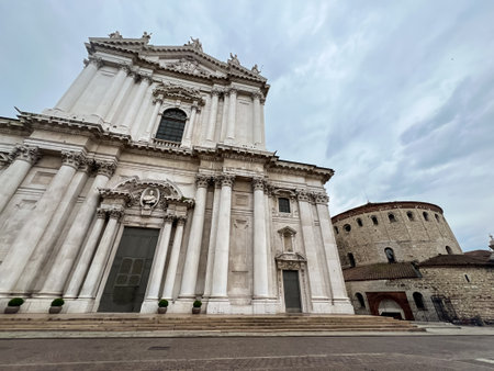 Brescia downtown. Old and new Cathedral of Santa Maria Assunta (Duomo Vecchio and Duomo Nuovo) in Romanesque and late Baroque style, Cathedral square or Paolo VI square. Lombardy, Italy, Europe.の写真素材