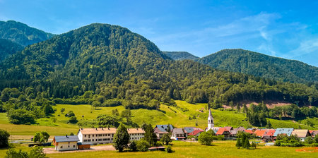 The small italian alpine village of San Leopoldo, hamlet of Pontebba in the region of Friuli. The antique church of Santa Geltrude dated to 14th centuryの写真素材