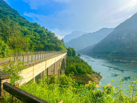 Valvestino lake and Recchi bridge during rain. Colorful summer scene of Val di Vesta Natural Park, Italy, Europe. Beauty of nature concept background.の写真素材