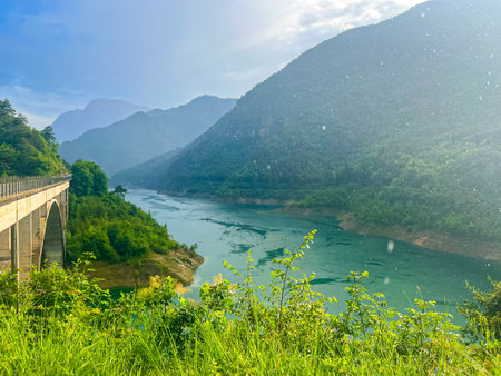 Valvestino lake and Recchi bridge during rain. Colorful summer scene of Val di Vesta Natural Park, Italy, Europe. Beauty of nature concept background.の写真素材