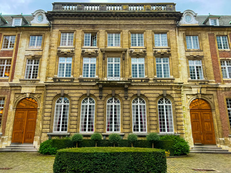 A stunning grand palace surrounded by lush gardens, featuring classic european architecture. The vibrant greenery enhances the palaces elegance, ideal for travel and architectural themes.の写真素材