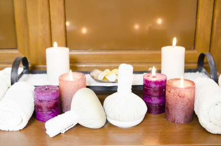 Thai massage herbal balls with towwels and cangles for relaxation and thai massageの写真素材