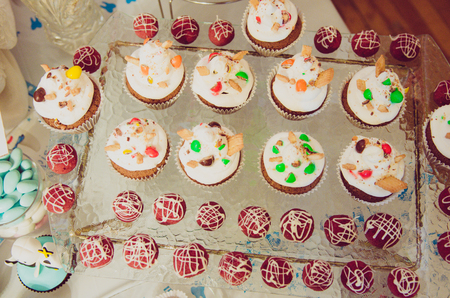 Beautiful candy bar with cakes, cake-pop, marshmallow for children or baby first tooth party の写真素材