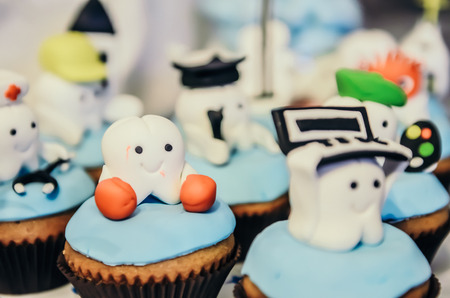 Beautiful cake with tooth heroes on top for children first tooth partyの写真素材