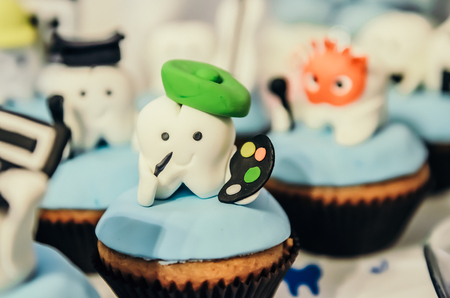 Beautiful cake with painter tooth hero on top for children first tooth partyの写真素材