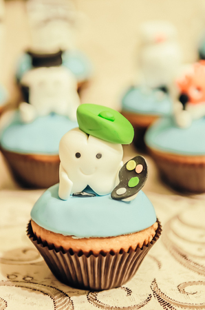 Beautiful cake with painter tooth hero on top for children first tooth partyの写真素材