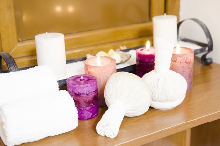 Thai massage herbal balls with towwels and cangles for relaxation and thai massageの写真素材