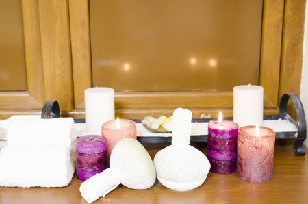 Thai massage herbal balls with towwels and cangles for relaxation and thai massageの写真素材