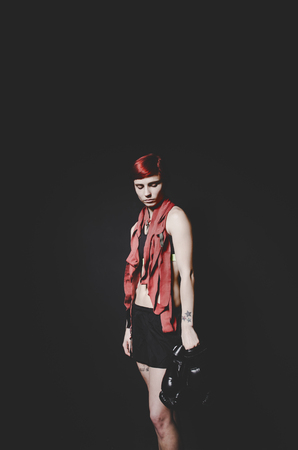 young tattooed woman boxer close up portraitの写真素材