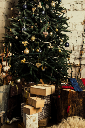 Set of beautiful men accessories of bow tie, neck tie, cufflinks, man's scarf with present box on christmas tree backgroundの写真素材