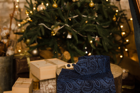 Beautiful blue classic polka dot bow tie , cufflinks, men's scarf and neck tie on wooden present boxの写真素材
