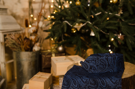 Beautiful blue classic polka dot bow tie , cufflinks, men's scarf and neck tie on wooden present boxの写真素材