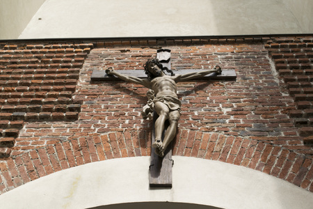 Old medieval crucifix in church - made of wood
