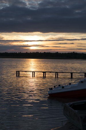 A nice sunset over the lake surfaceの写真素材