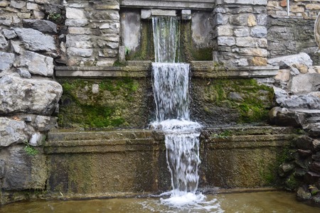beautiful fountain with a waterfall in the parkの写真素材
