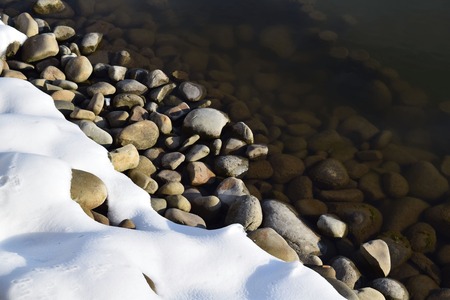 Beautiful winter coast, snowy shore of winter lakeの写真素材