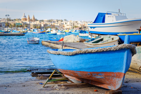 Luzzu aground in Marsaxlokk, Maltaの写真素材