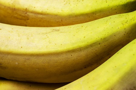 Fresh bananas on a wooden table.の写真素材