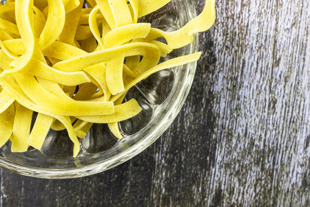 Pasta on a wooden table.の写真素材