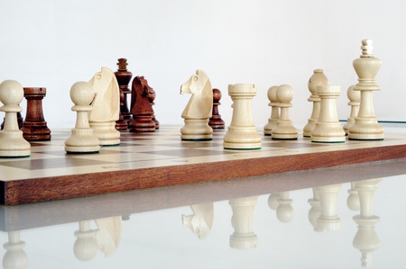 Chess pieces on wood board