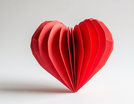 3D origami red paper heart on a white background.の写真素材
