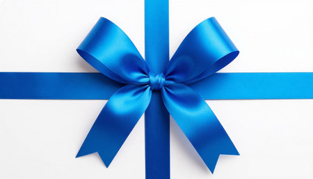 Blue Satin Ribbon Bow on White Background. Elegant Gift Decoration for Holidays, Promotions and Branding.の写真素材