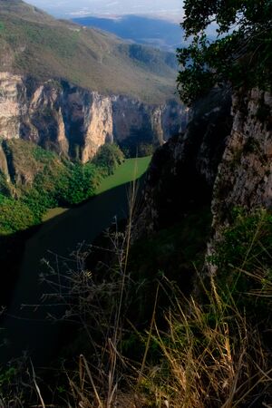 Aerial view of the Sumidero Canyon in Chiapas, Mexico. View of the river between the mountains with native plants and the cloudy skyの写真素材