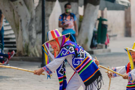 MORELIA, MEXICO - OCTOBER 31, 2020: Traditional dance of the old men in the main square of Morelia, Mexicoのeditorial素材