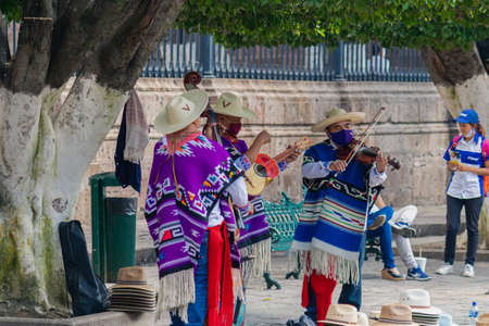 MORELIA, MEXICO - OCTOBER 31, 2020: Traditional dance of the old men in the main square of Morelia, Mexicoのeditorial素材