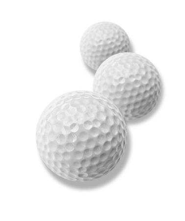 three white golf balls with drop shadowの写真素材