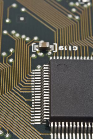 A dark microprocessor on a circuit board.
